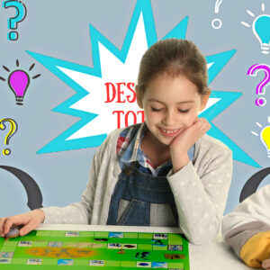 Niña concentrada jugando al tablero de Desafío Total, un juego de mesa educativo de Crecer Creando que combina cálculo mental, pensamiento lógico y lateral.